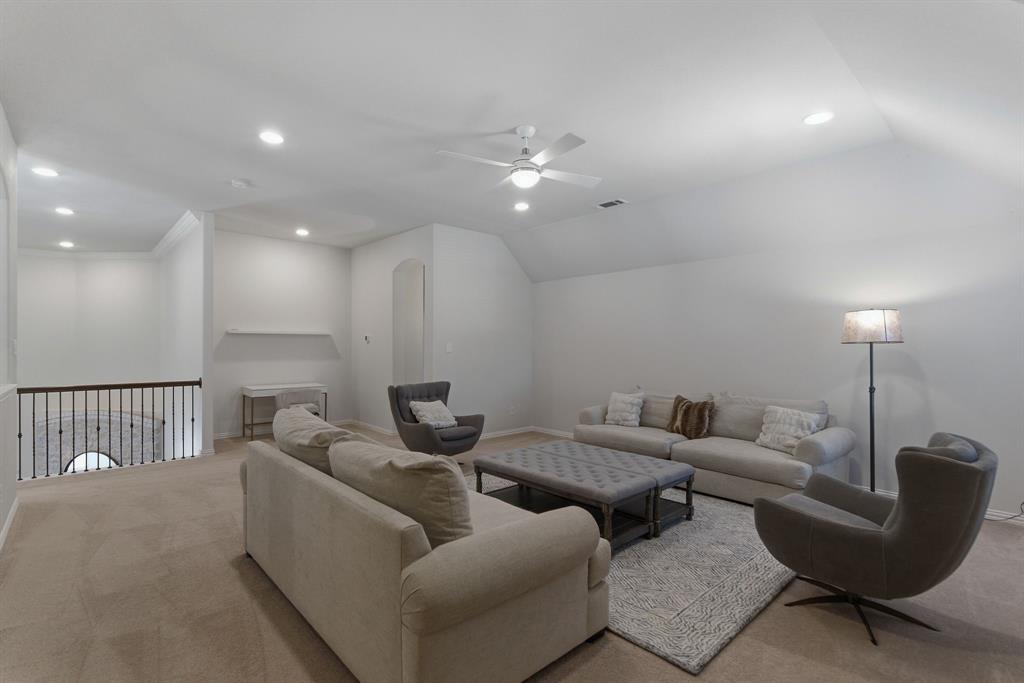 2801 Seabiscuit Road Celina, TX 75009 - Photo 22 of 39 Living area with carpet, ceiling fan, recessed lighting, and lofted ceiling