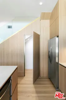 a en suite bathroom with a granite countertop sink a mirror and shower