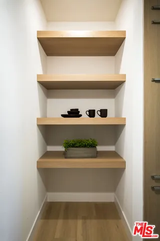 a balcony with table and chairs