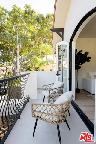 a bathroom with a granite countertop sink mirror and shower