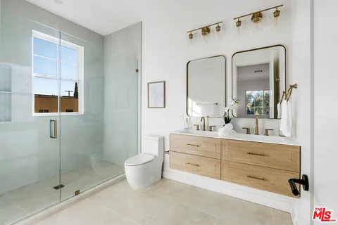 a bathroom with a shower and a sink