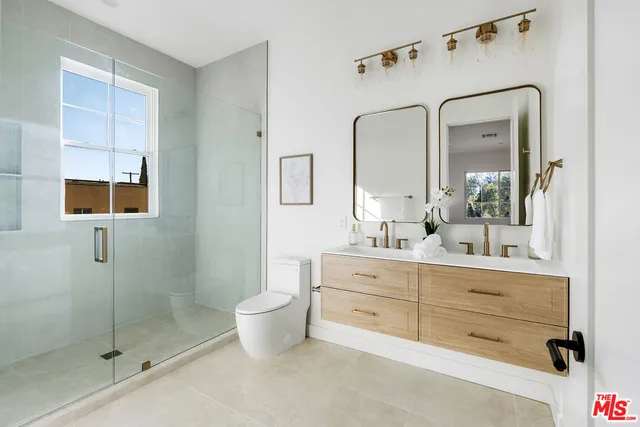 a bathroom with a shower and a sink