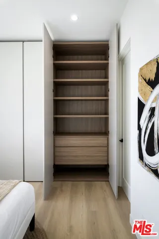 a bathroom with a double vanity sink toilet mirror and shower
