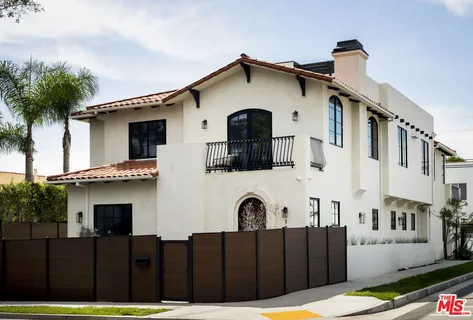 a front view of a house with glass windows
