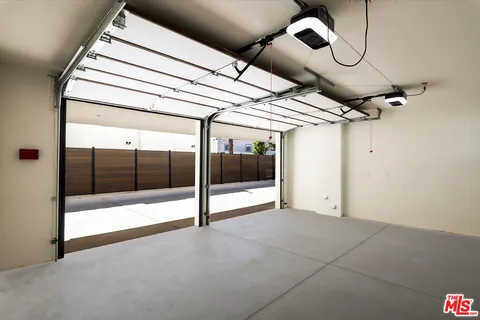 a bedroom with a bed and a potted plant