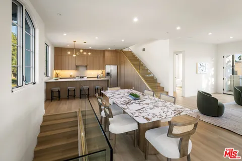 a view of a chairs and table in patio