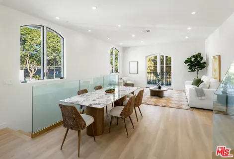a view of a dining room with furniture window and outside view