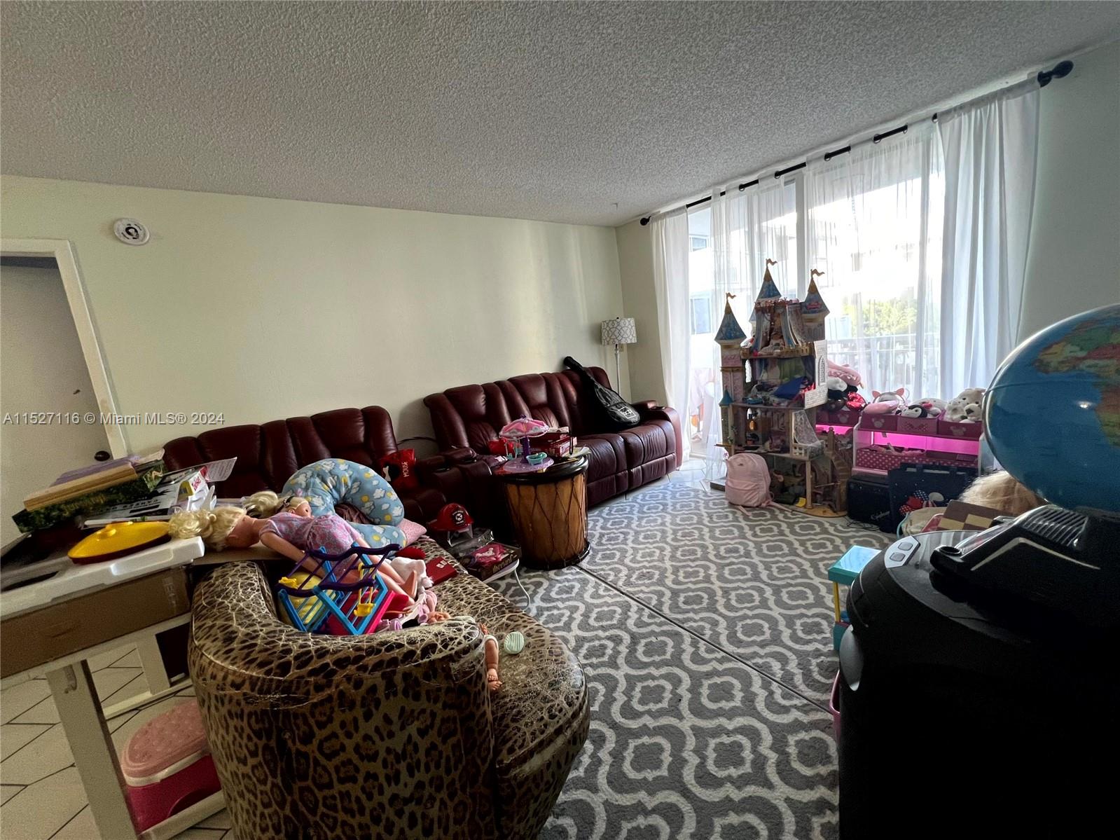 1665 Bay Road, Unit 425 Miami Beach, FL 33139 - Photo 11 of 29 a bedroom with furniture and a window