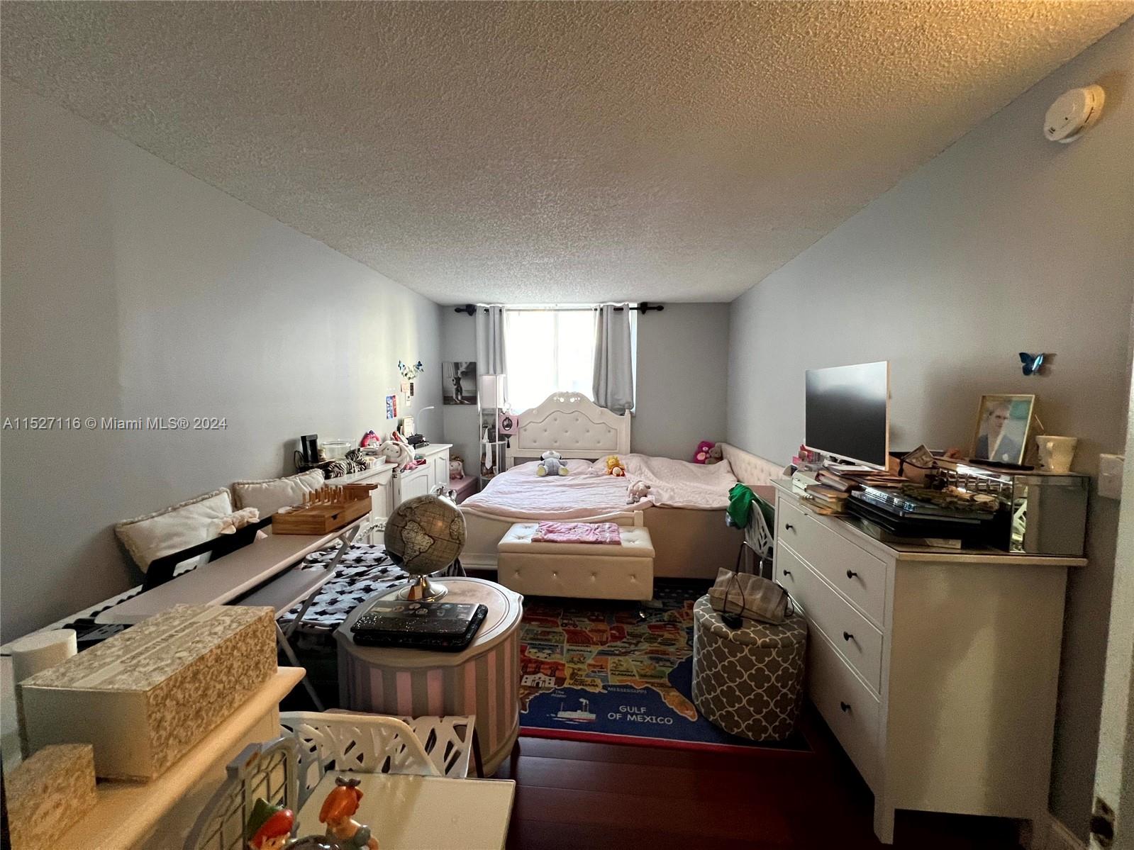 1665 Bay Road, Unit 425 Miami Beach, FL 33139 - Photo 15 of 29 a living room with furniture fireplace and a lamp