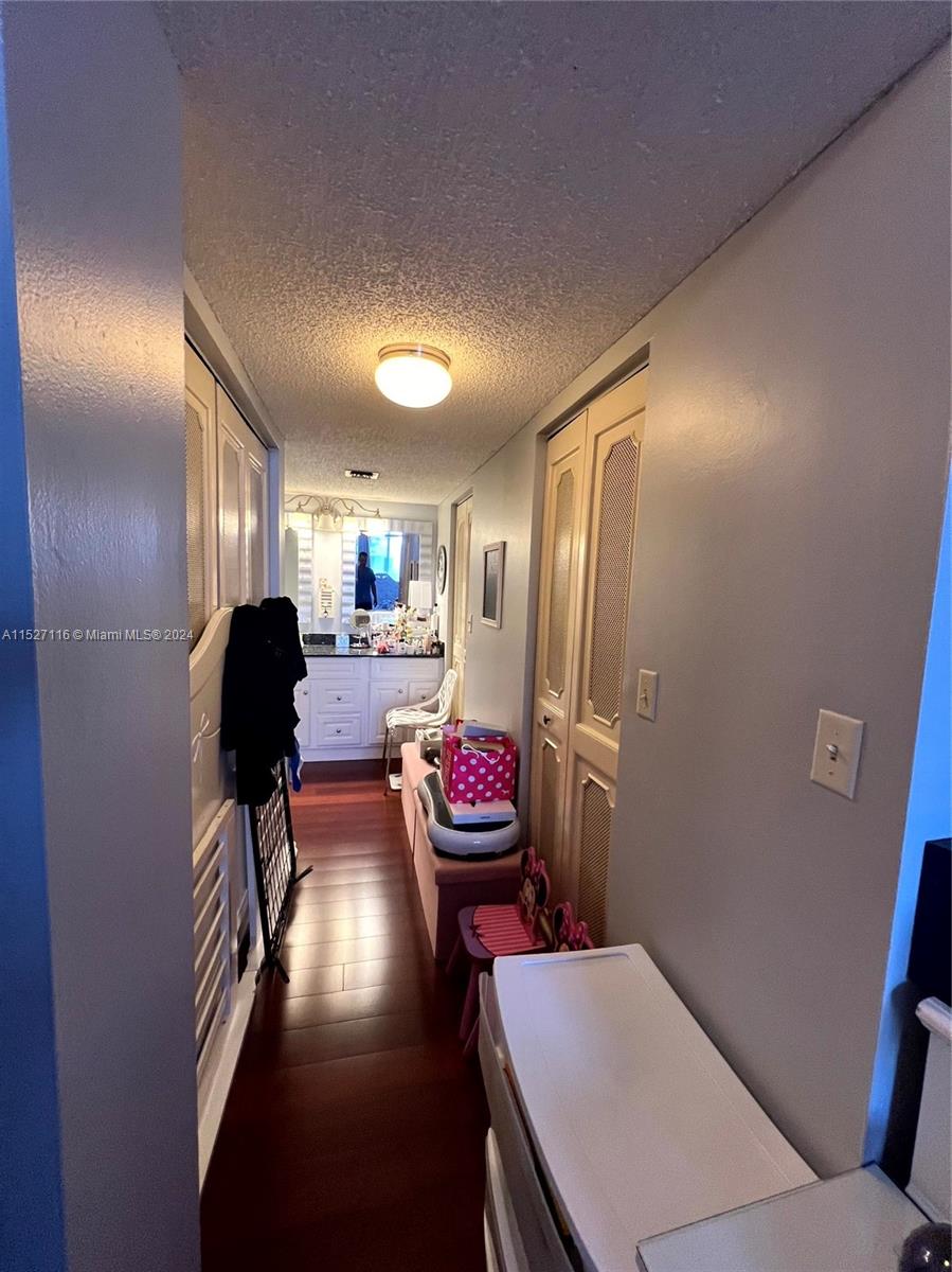 1665 Bay Road, Unit 425 Miami Beach, FL 33139 - Photo 17 of 29 a living room with furniture and a refrigerator