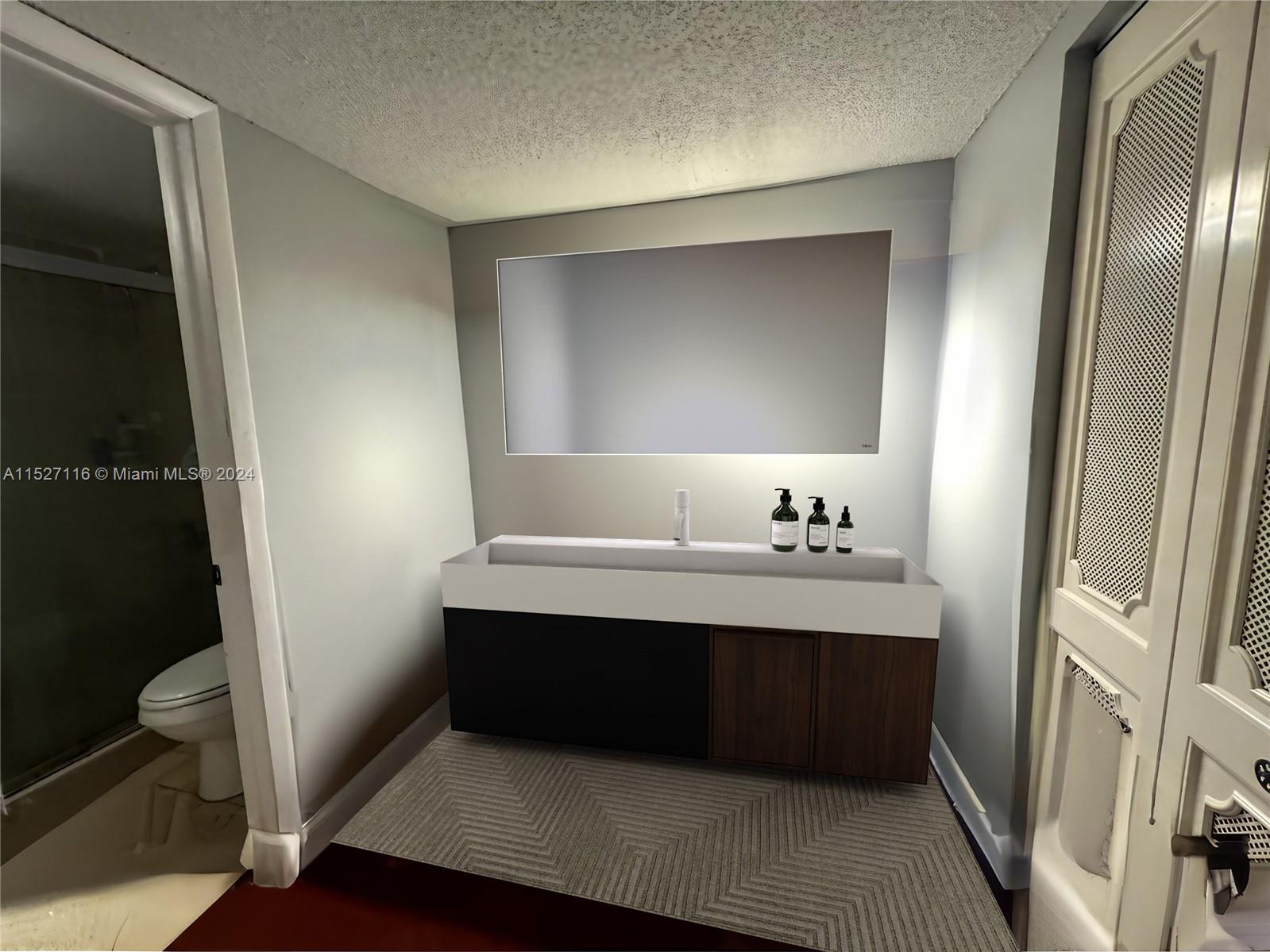 1665 Bay Road, Unit 425 Miami Beach, FL 33139 - Photo 18 of 29 a bathroom with a sink and a mirror