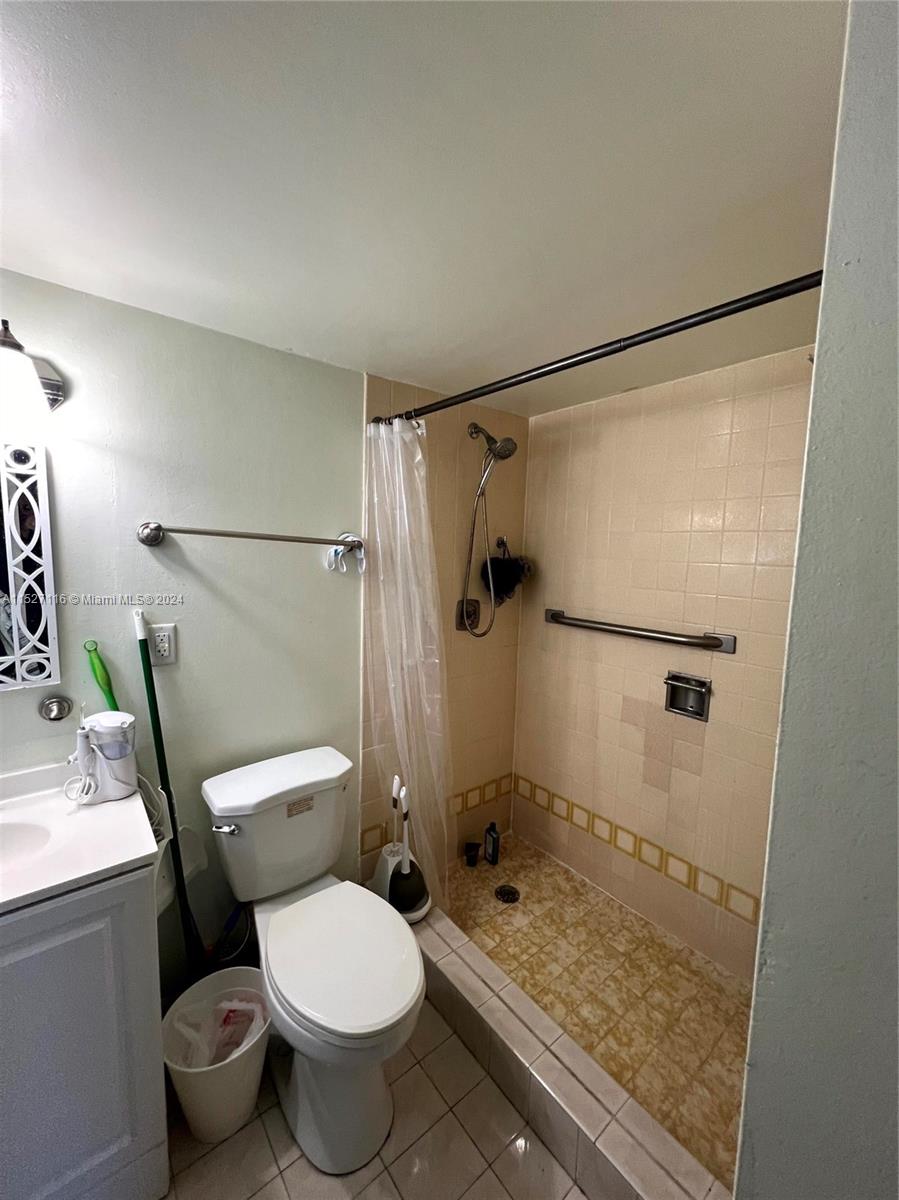 1665 Bay Road, Unit 425 Miami Beach, FL 33139 - Photo 21 of 29 a bathroom with a toilet and a shower