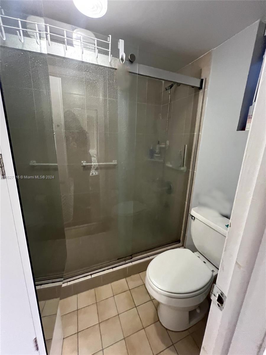 1665 Bay Road, Unit 425 Miami Beach, FL 33139 - Photo 24 of 29 a bathroom with a toilet and a shower
