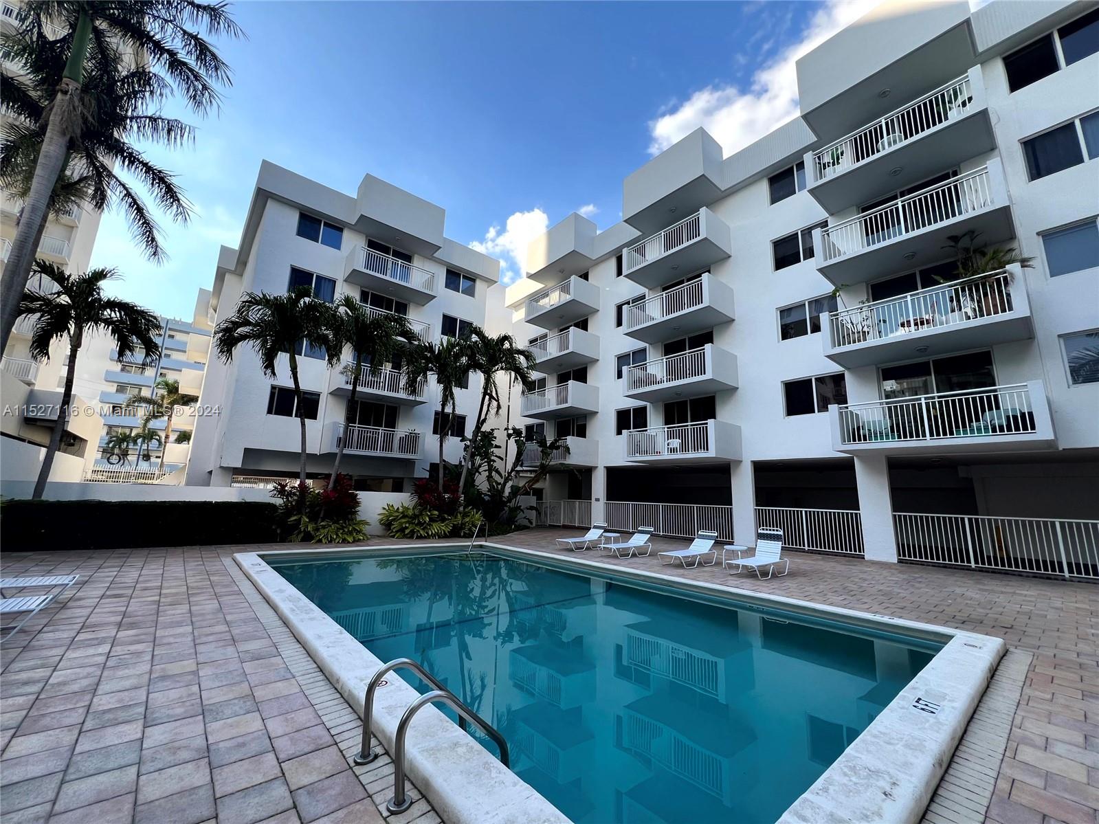 1665 Bay Road, Unit 425 Miami Beach, FL 33139 - Photo 3 of 29 a view of pool with outdoor seating