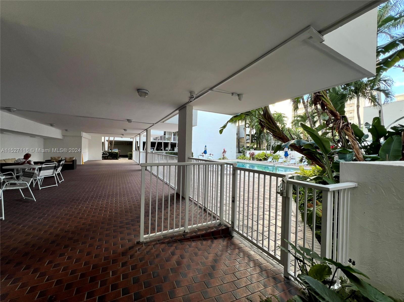 1665 Bay Road, Unit 425 Miami Beach, FL 33139 - Photo 4 of 29 a view of a porch and garden
