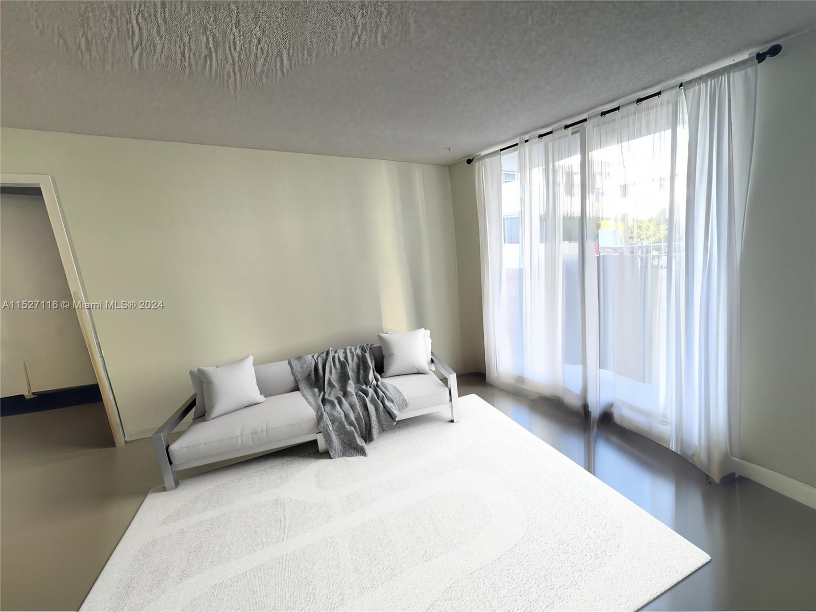 1665 Bay Road, Unit 425 Miami Beach, FL 33139 - Photo 10 of 29 a bedroom with a bed and a couch