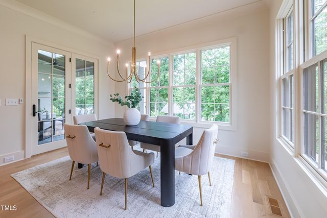 a kitchen with sink cabinets and wooden floor