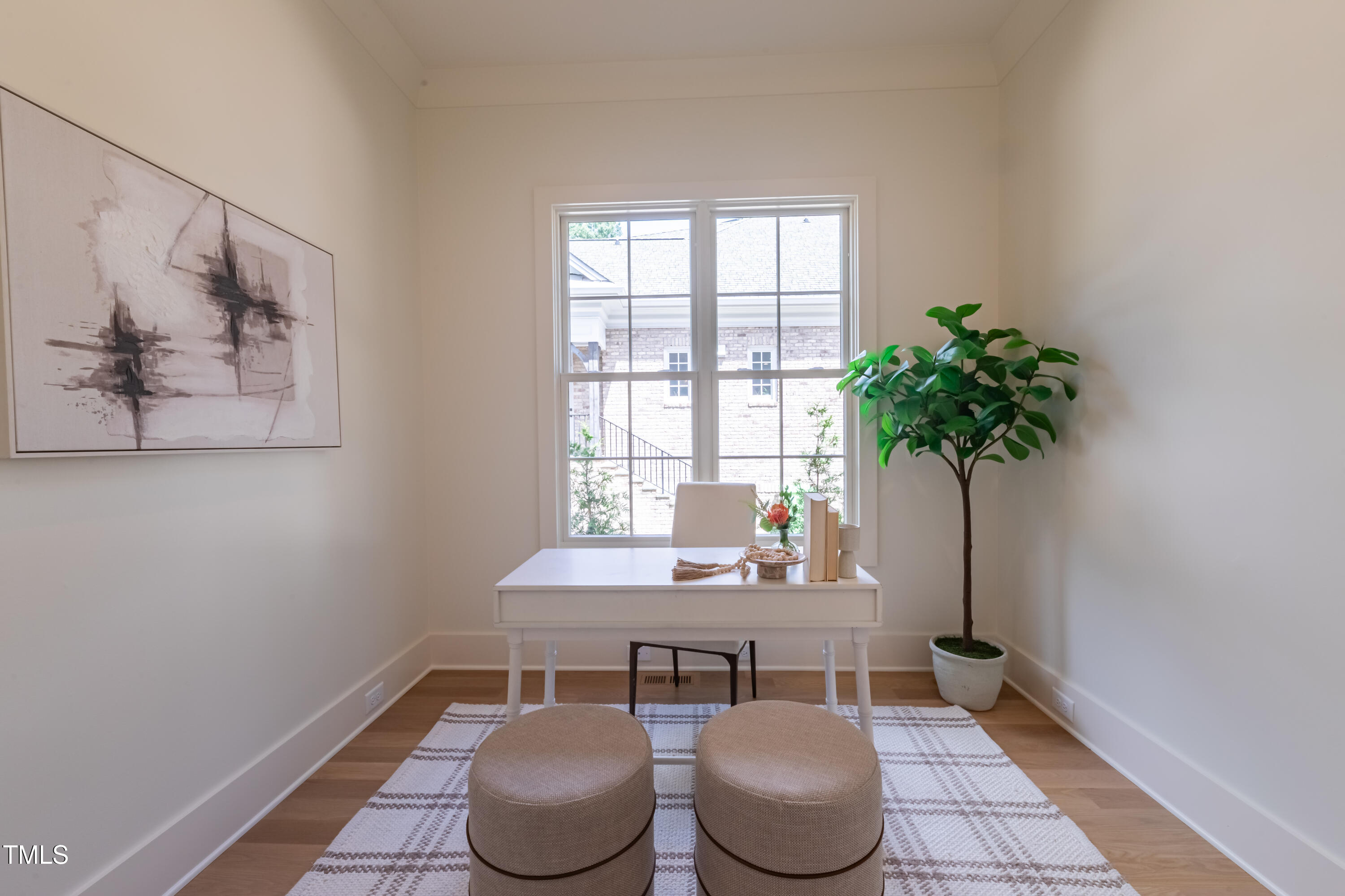 2227 Wheeler Road Raleigh, NC 27607 - Photo 29 of 56 a dining room with furniture and a potted plant