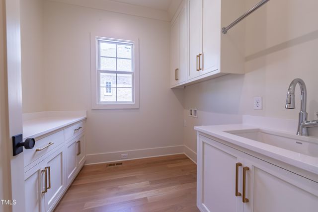 a bathroom with a bathtub shower sink and mirror