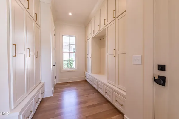 a bathroom with a double vanity sink mirror and shower