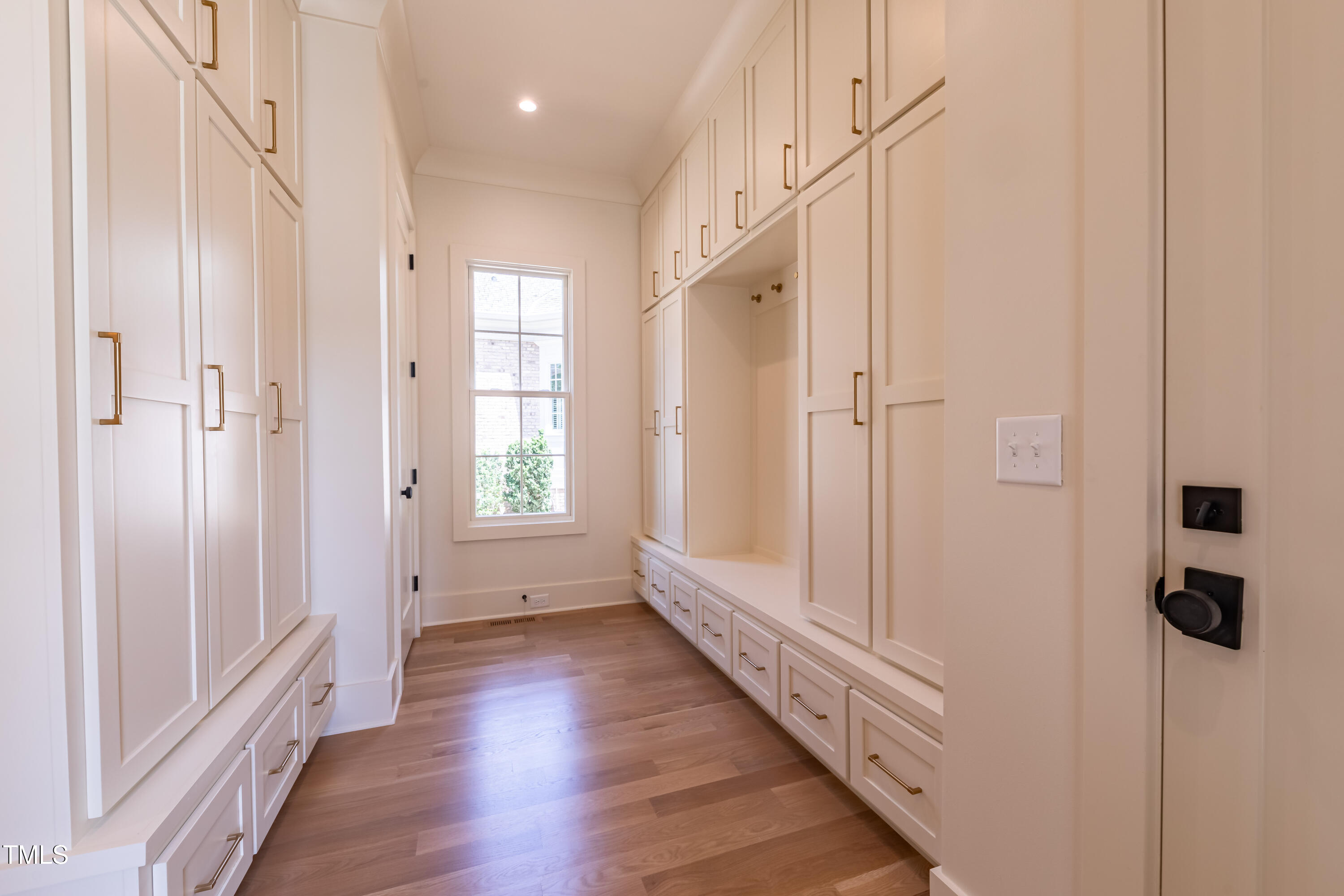 2227 Wheeler Road Raleigh, NC 27607 - Photo 31 of 56 a view of a hallway with wooden floor and staircase