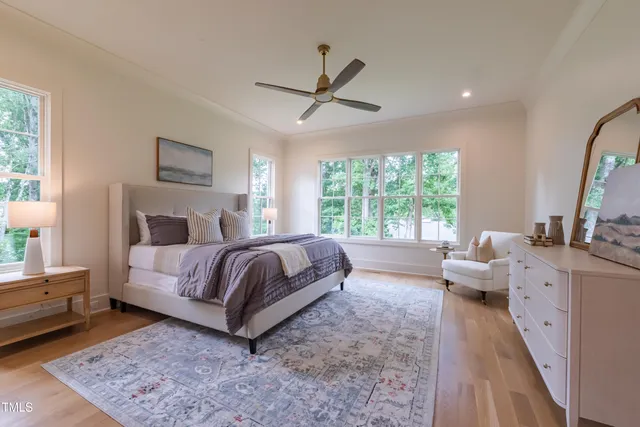 a spacious bathroom with a granite countertop sink a toilet and a mirror