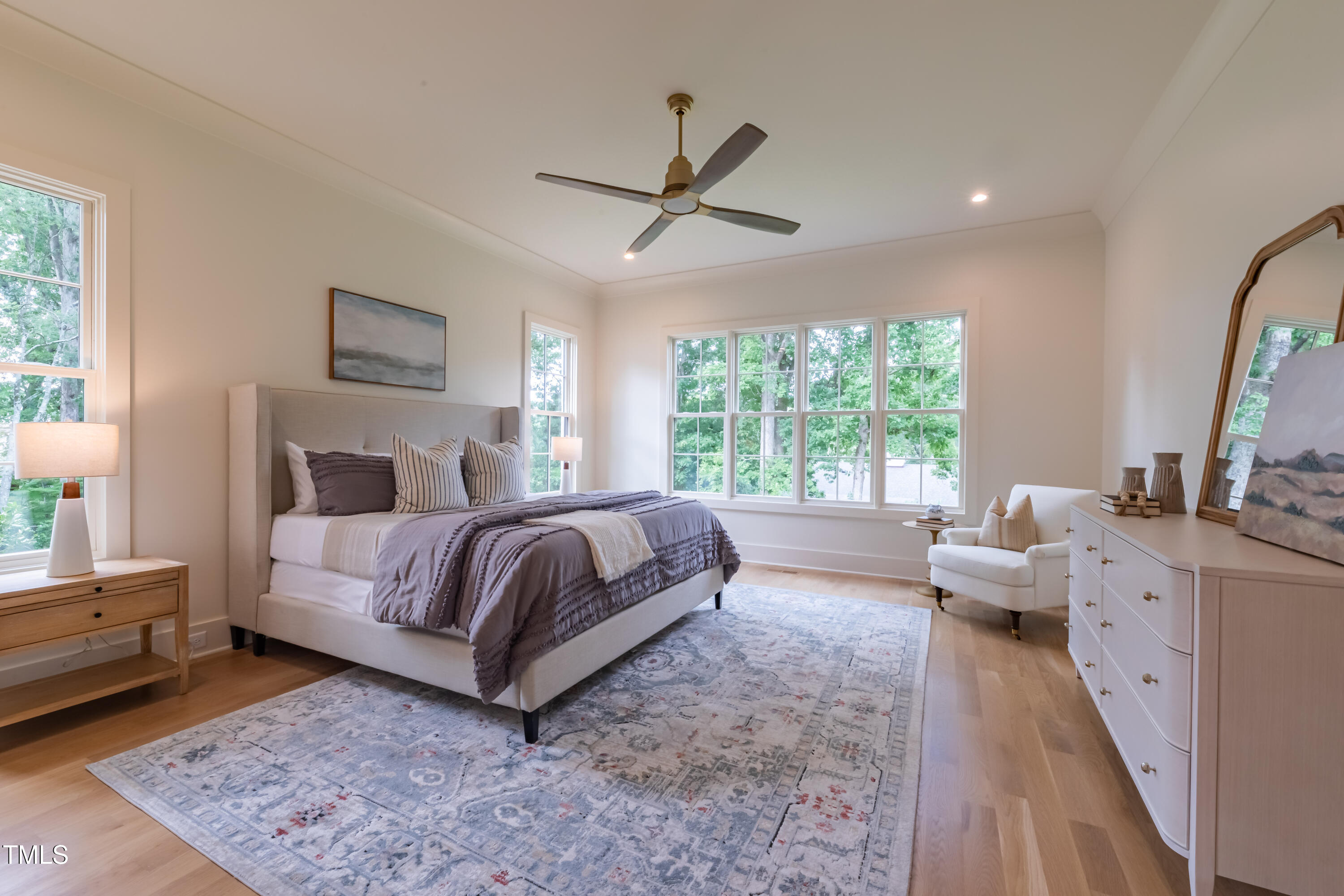 2227 Wheeler Road Raleigh, NC 27607 - Photo 32 of 56 a spacious bedroom with a large bed and windows