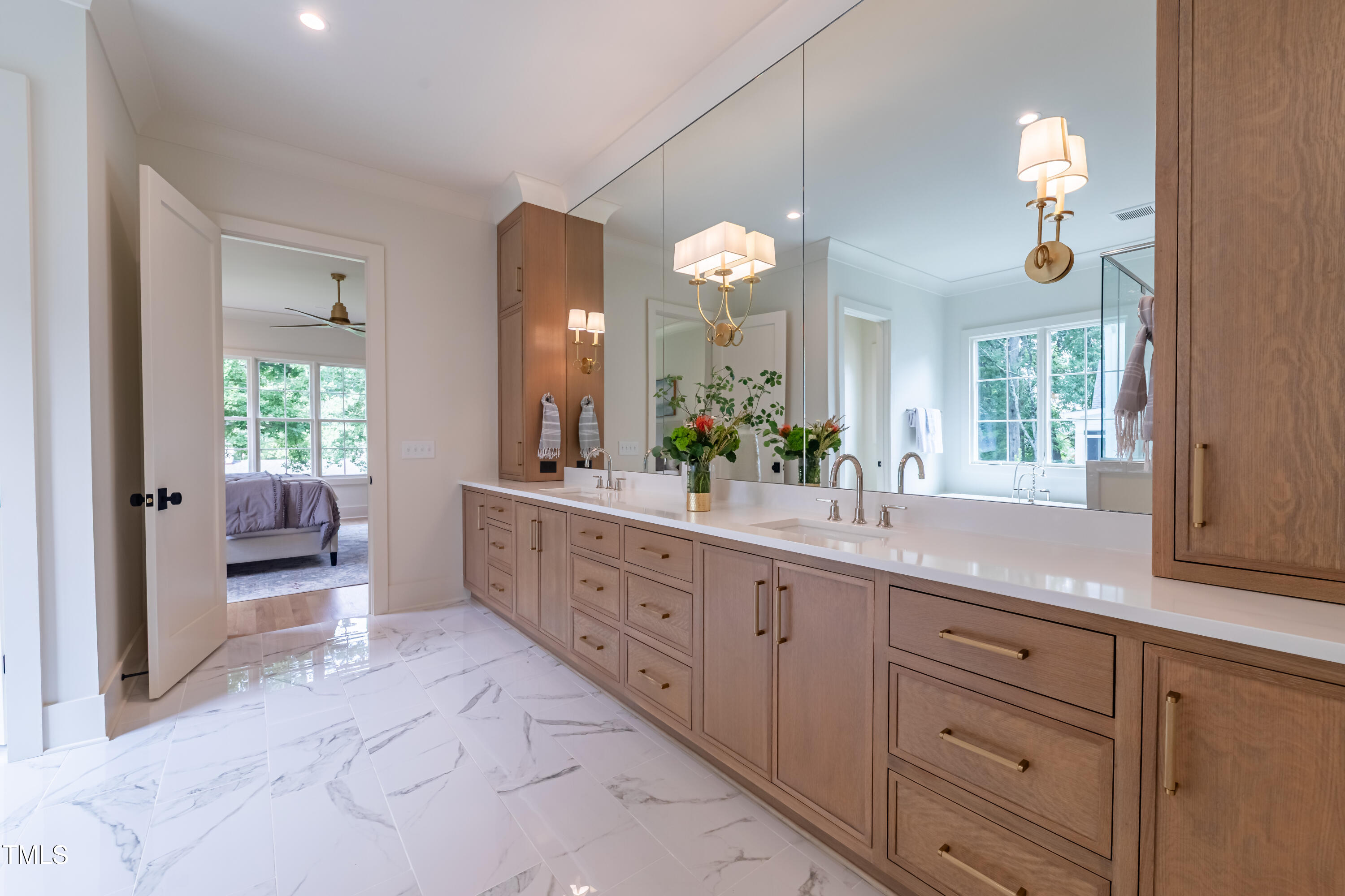 2227 Wheeler Road Raleigh, NC 27607 - Photo 37 of 56 a spacious bathroom with a granite countertop sink a toilet and a mirror