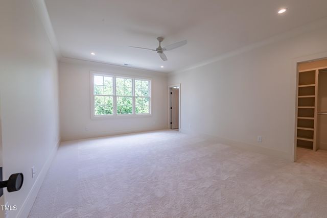 a view of a patio with chairs and a table