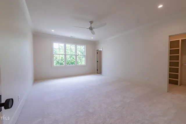 a view of a patio with chairs and a table
