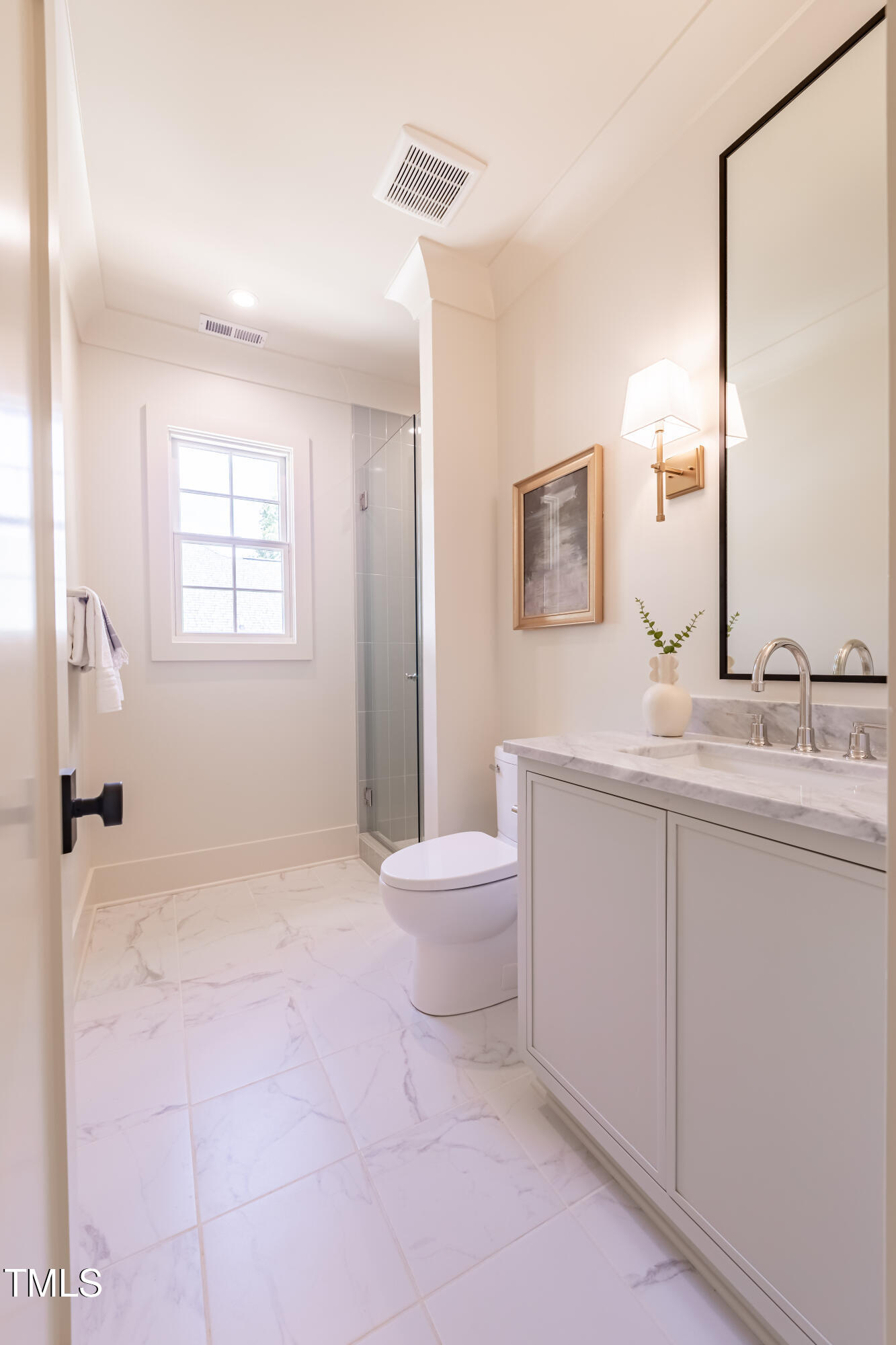 2227 Wheeler Road Raleigh, NC 27607 - Photo 47 of 56 a bathroom with a sink toilet and mirror