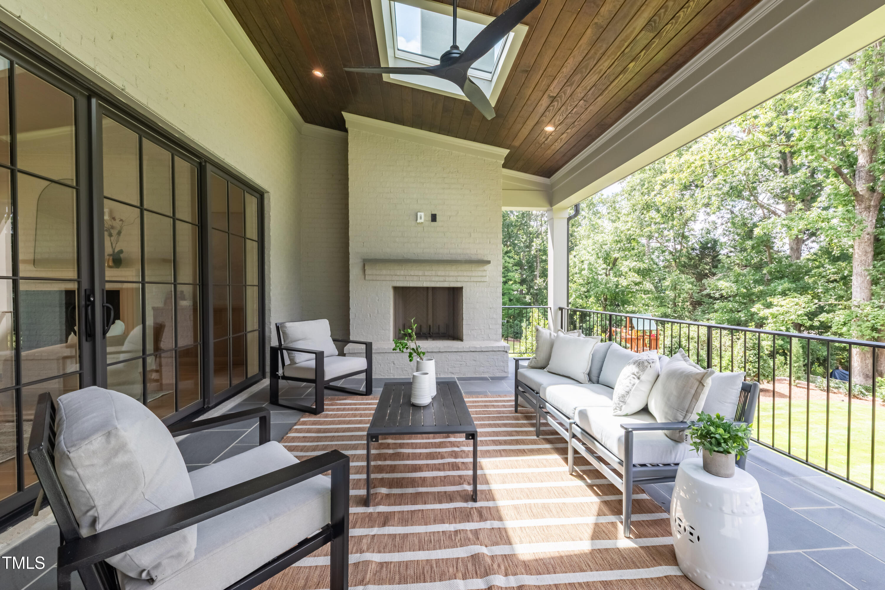 2227 Wheeler Road Raleigh, NC 27607 - Photo 50 of 56 a living room with furniture fireplace and a large window
