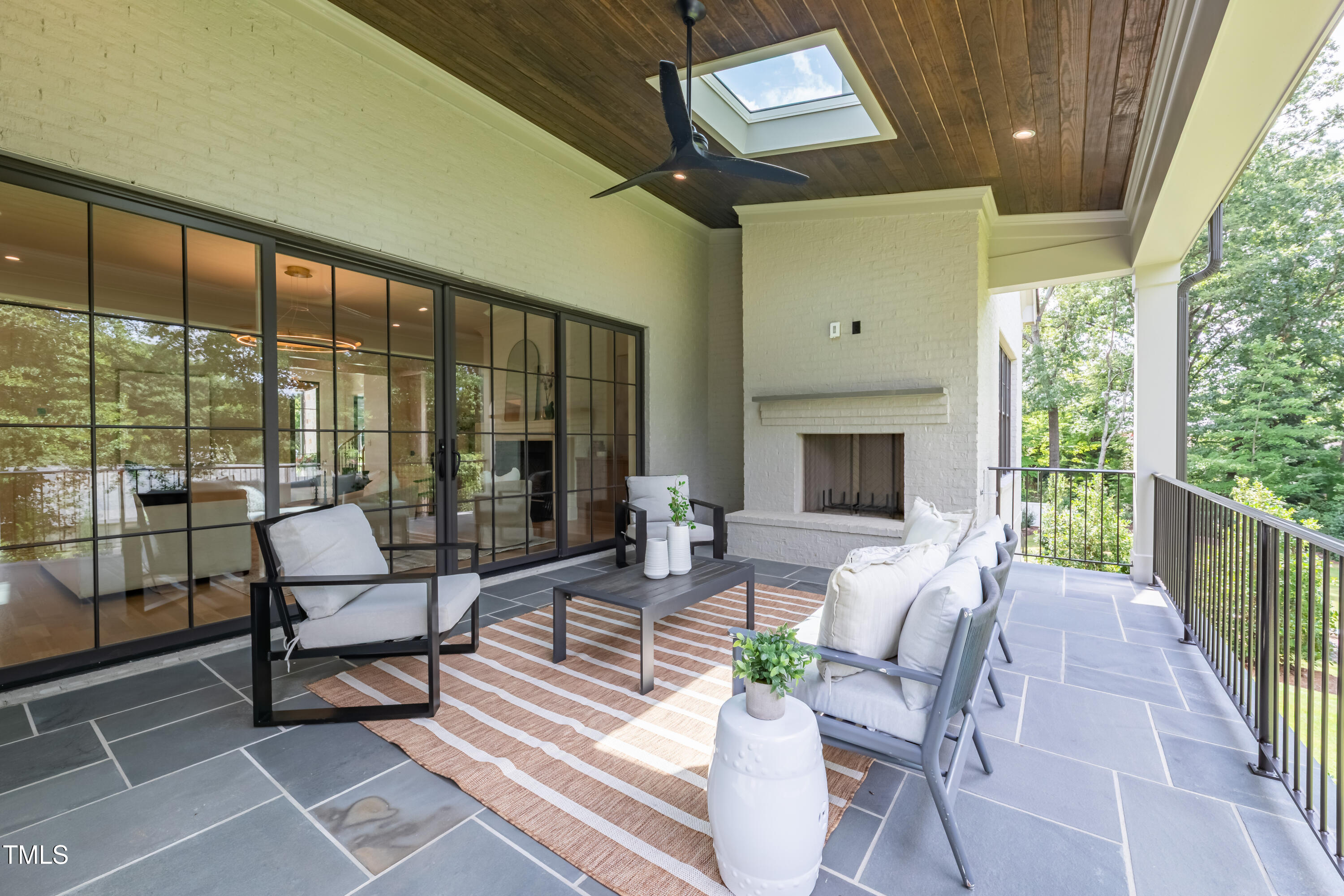 2227 Wheeler Road Raleigh, NC 27607 - Photo 51 of 56 a living room with furniture fireplace and a large window