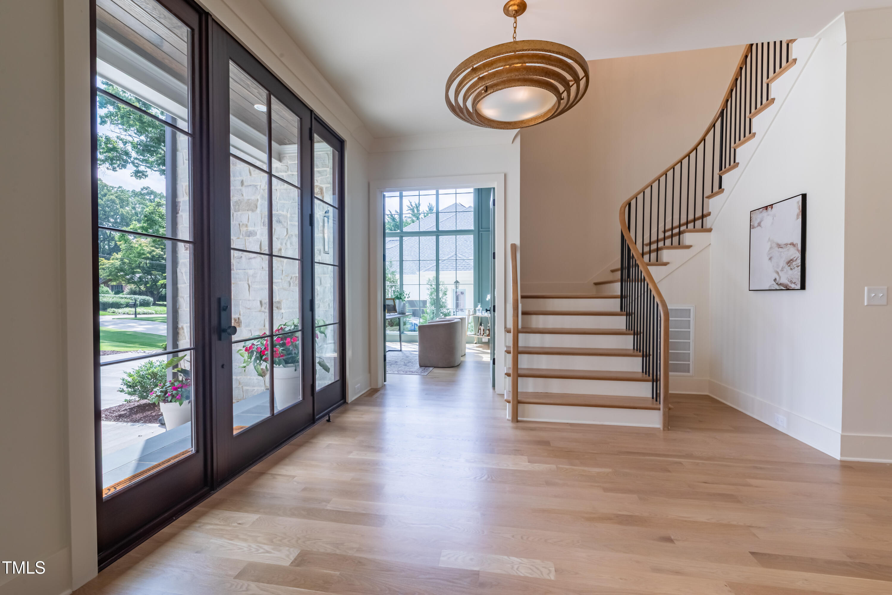 2227 Wheeler Road Raleigh, NC 27607 - Photo 7 of 56 a view of entryway and hall with wooden floor