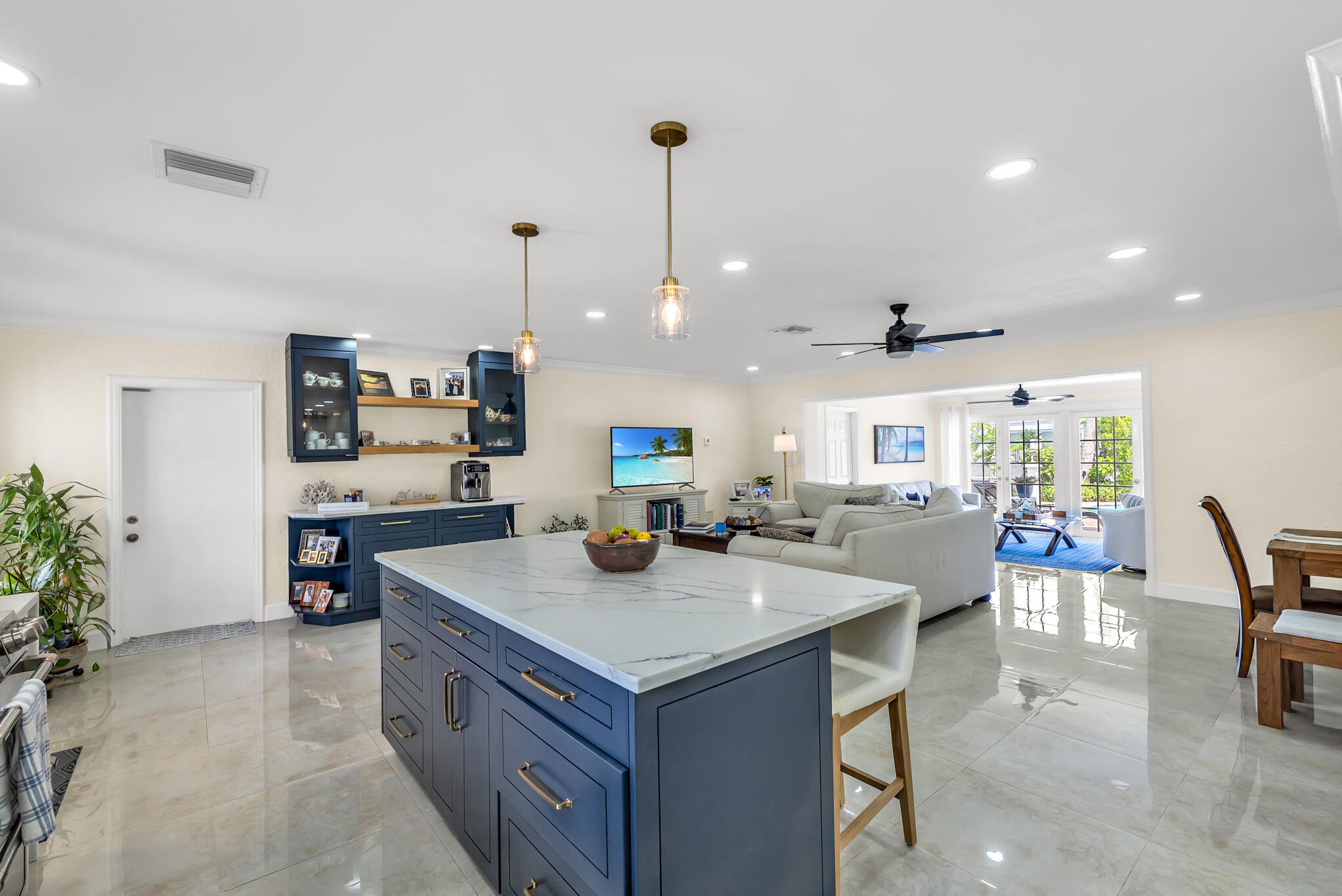 4920 Northeast 28th Avenue Lighthouse Point, FL 33064 - Photo 18 of 38 a view of kitchen island a sink and living room view