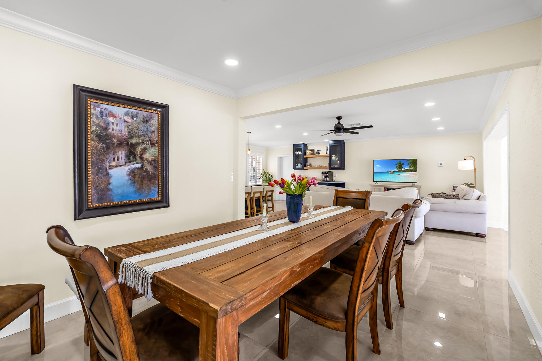 4920 Northeast 28th Avenue Lighthouse Point, FL 33064 - Photo 21 of 38 a dining room with a table and chairs