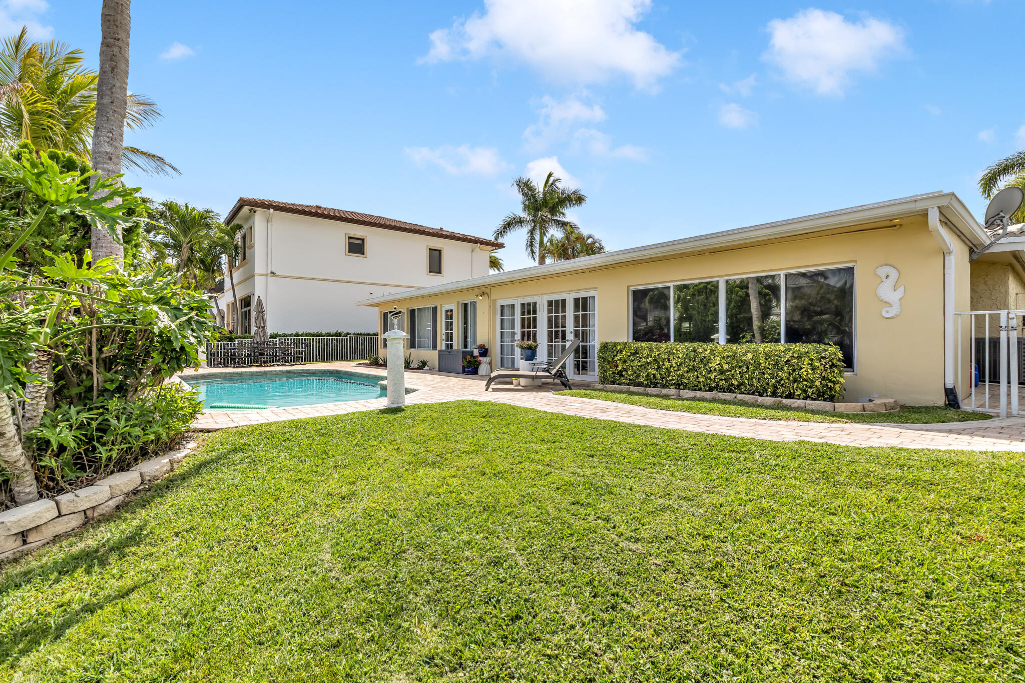 4920 Northeast 28th Avenue Lighthouse Point, FL 33064 - Photo 7 of 38 a view of a house with swimming pool and porch
