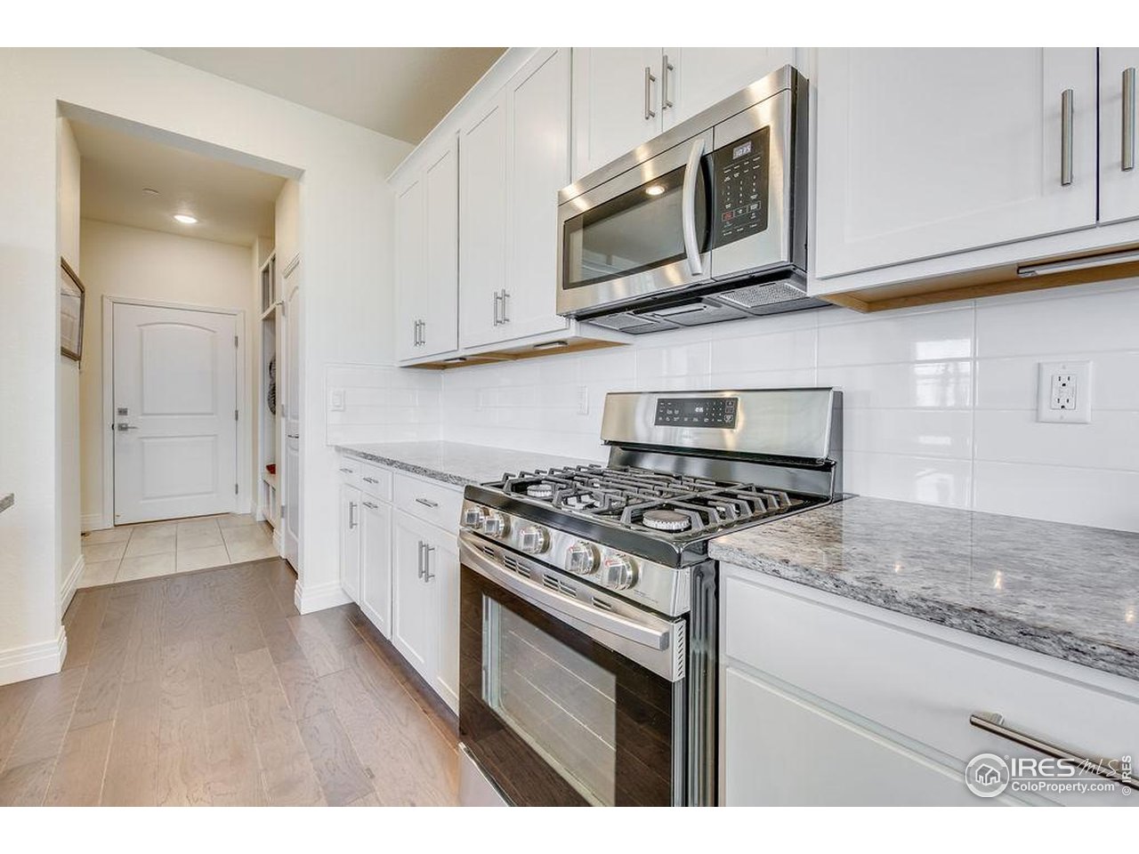 1102 Kitty Hawk Court Fort Collins, CO 80526 - Photo 12 of 37 Gas cooktop and stainless appliances