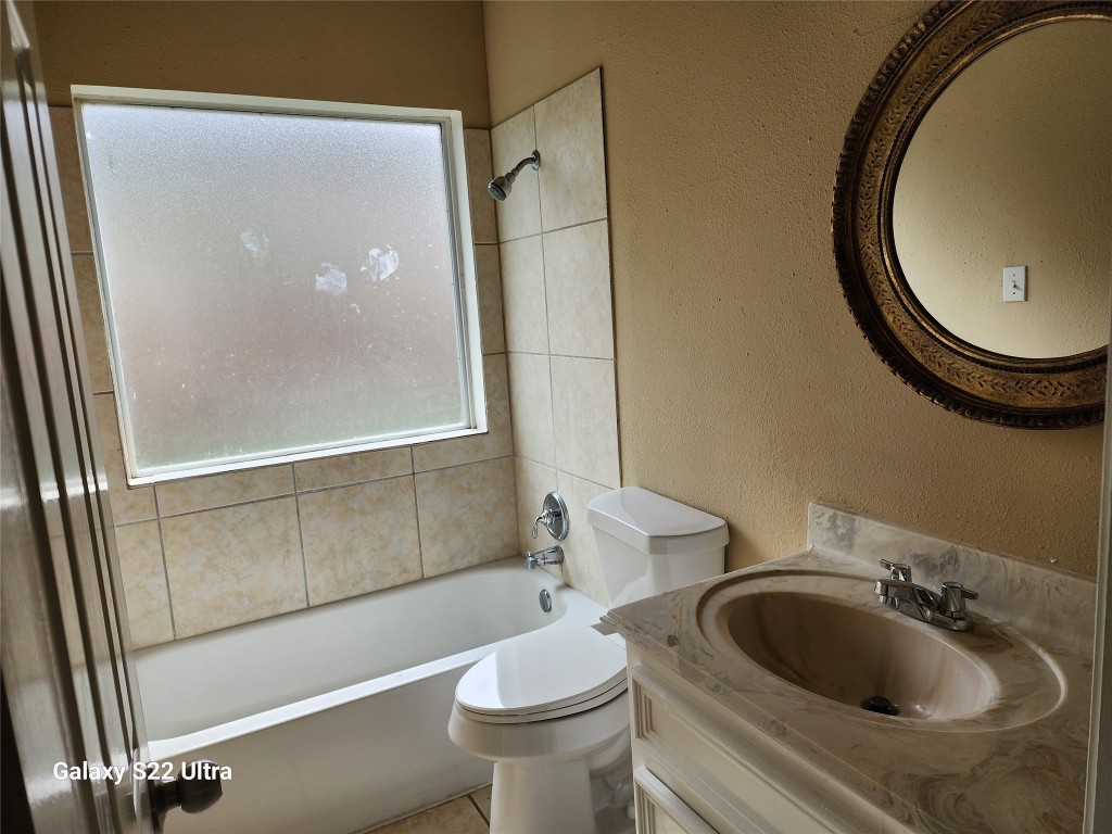 1926 Wavell Street Houston, TX 77088 - Photo 15 of 19 a bathroom with a sink and a mirror