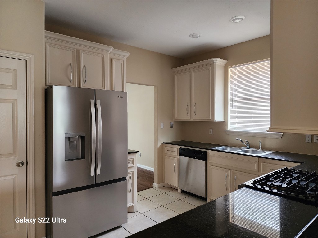1926 Wavell Street Houston, TX 77088 - Photo 10 of 19 a kitchen with stainless steel appliances granite countertop a refrigerator and a sink