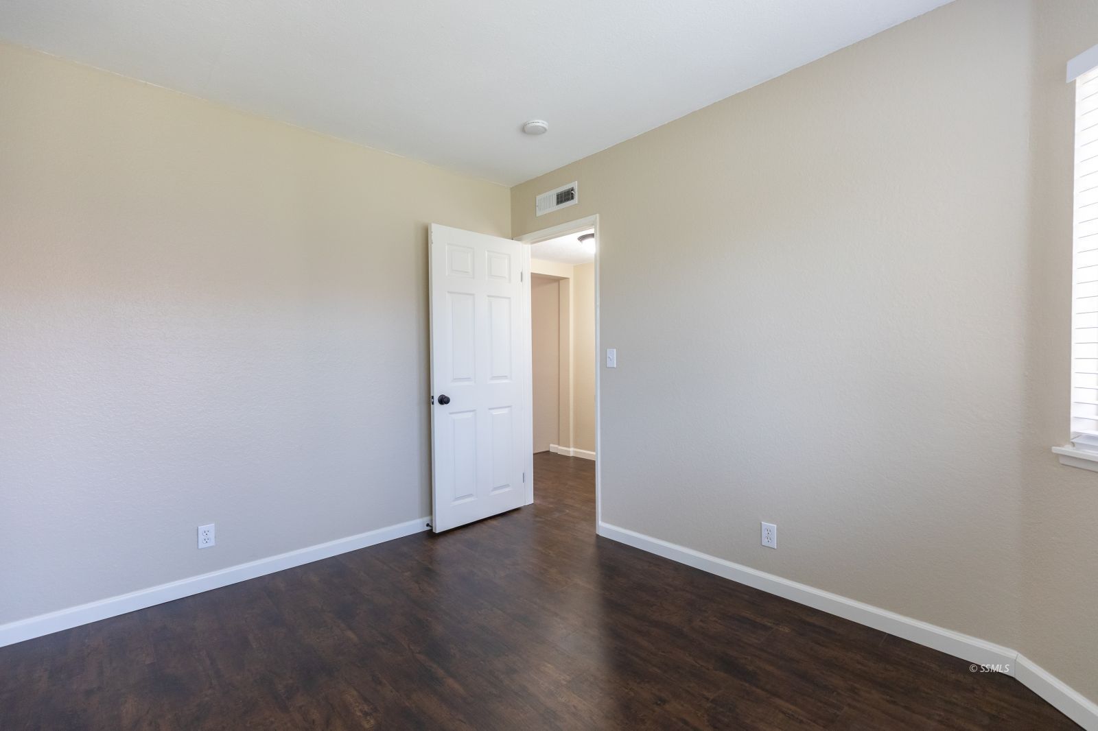 418 Tepatitlan Court Ridgecrest, CA 93555 - Photo 15 of 40 a view of an empty room with wooden floor