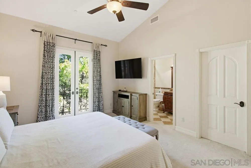 11558 Creek Poway Ca Poway, CA 92064 - Photo 42 of 74 a bedroom with a bed and a flat screen tv