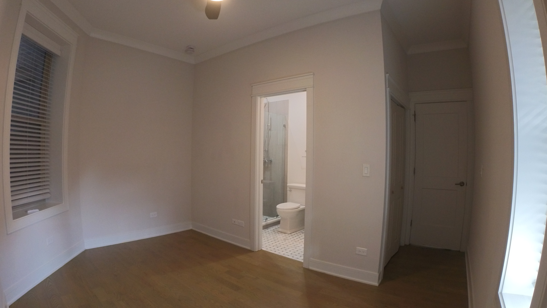 1215 West Erie Street, Unit 1 Chicago, IL 60642 - Photo 11 of 24 an empty room with windows