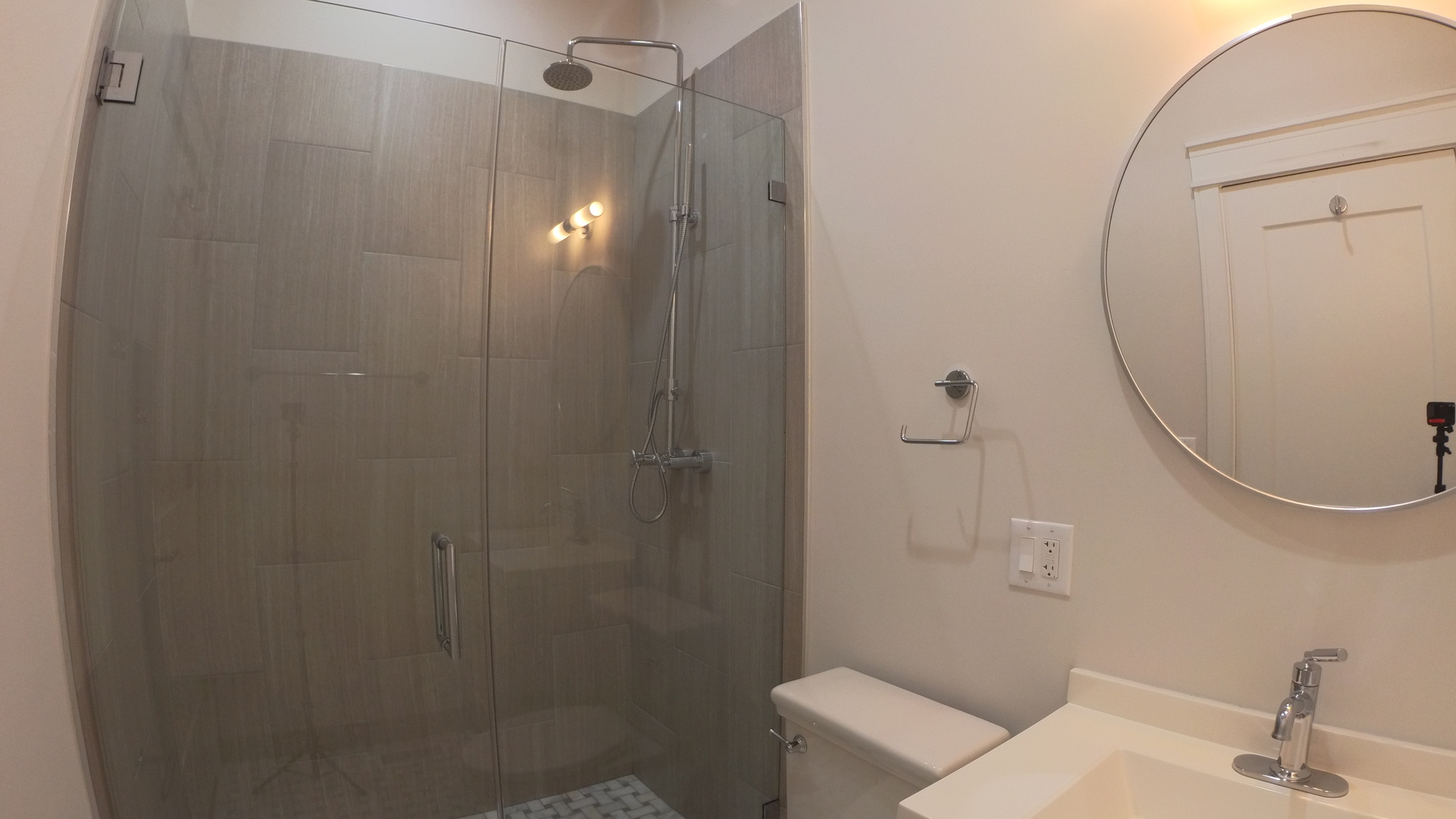 1215 West Erie Street, Unit 1 Chicago, IL 60642 - Photo 12 of 24 a bathroom with a sink and mirror