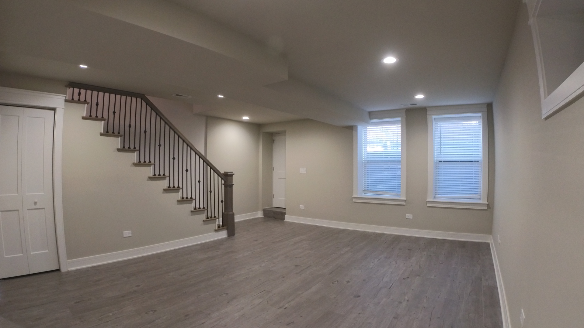 1215 West Erie Street, Unit 1 Chicago, IL 60642 - Photo 15 of 24 a view of an empty room with wooden floor and stairs
