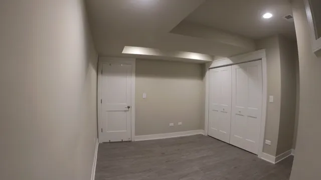 an empty room with closet area