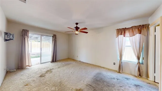 a view of a room with a flat screen tv and a window