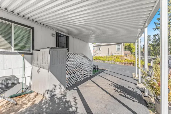 a view of a balcony with wooden floor