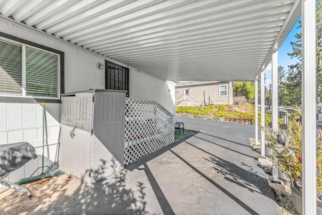 a view of a balcony with wooden floor