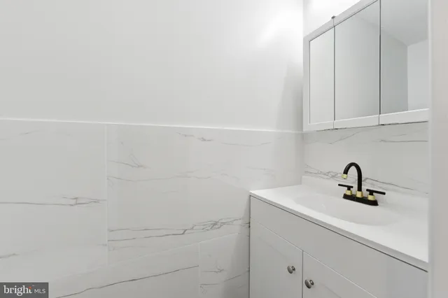 a bathroom with a sink and vanity